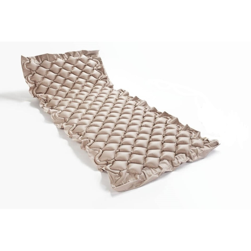 Non-powered vibrating mattress for pressure sore prevention